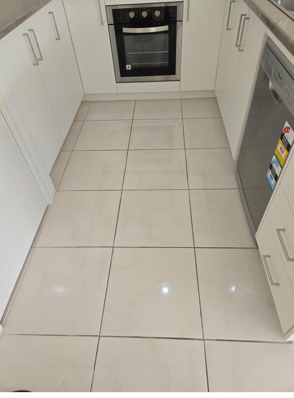 Residential kitchen tiles before grout cleaning